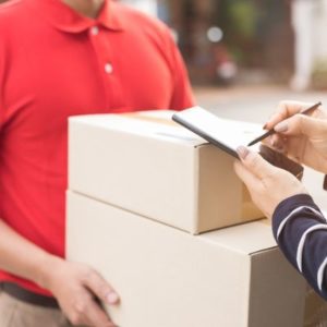 Person signing for a barcode printer delivery